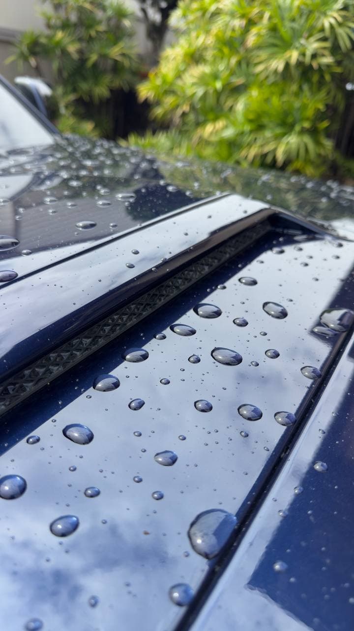 Water beading on ceramic coated vehicle in Hawaii — minerals sheet off instead of sitting